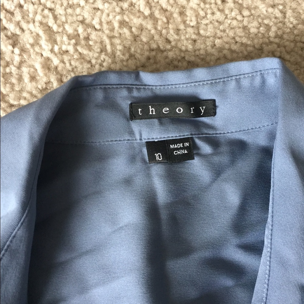 A gray theory tunic with tie